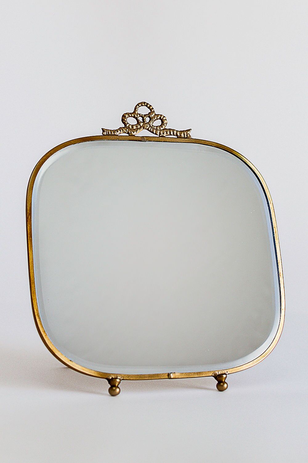 Bow Embossed Brass Vanity Mirror